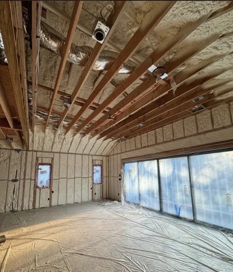 Interior walls and ceiling insulated with spray foam during new construction in Johnson Lane